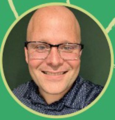 A person with glasses and a bald head smiles at the camera, embodying the essence of growth. They are wearing a dark-patterned shirt, perhaps hinting at their affiliation with Suidae Management Services. The green background features light green lines, adding to the vibrant atmosphere.